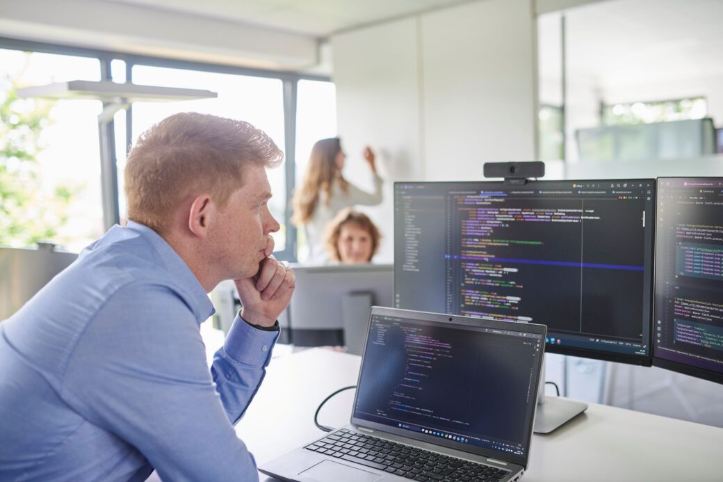 Employee looks at his code